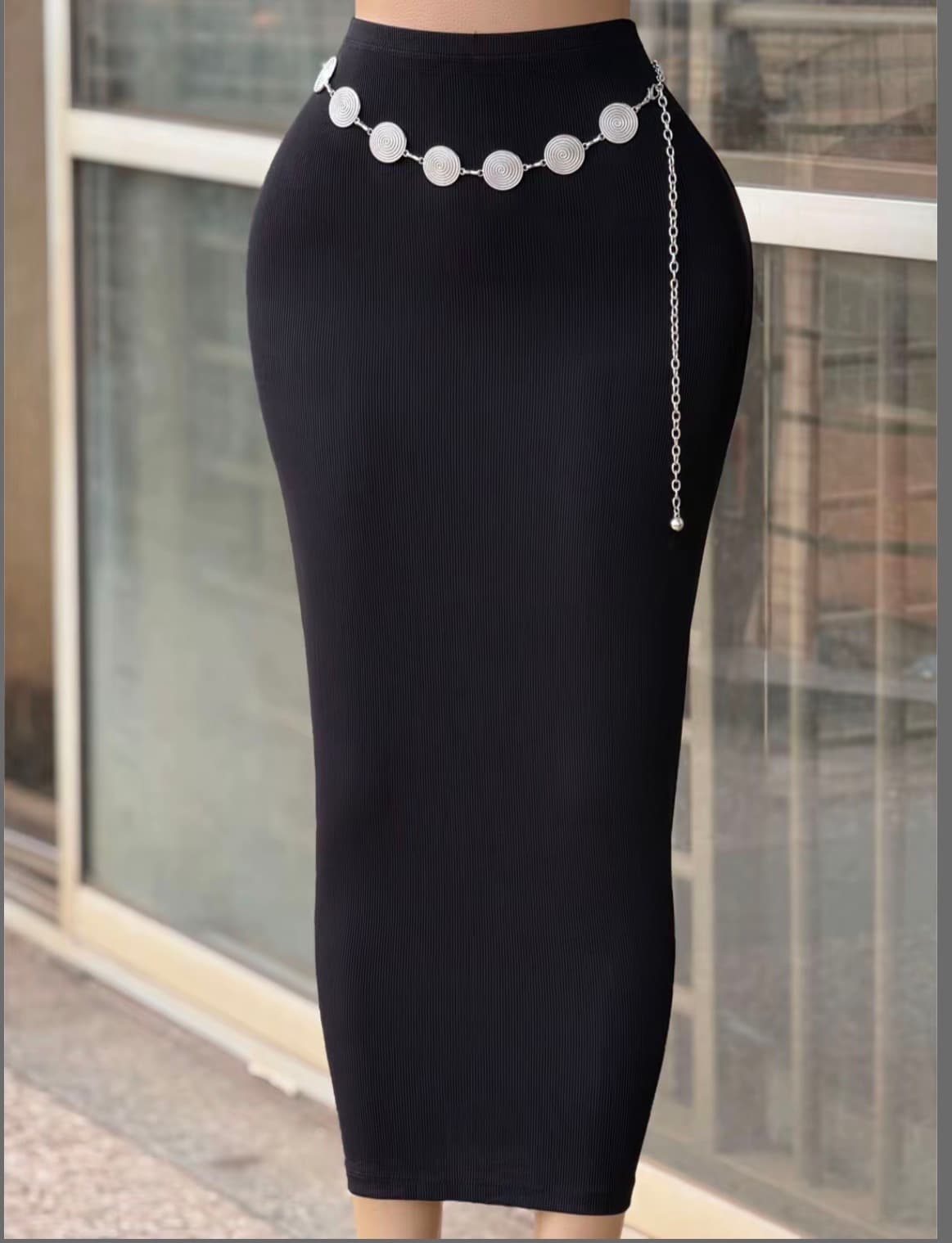 Black ribbed midi skirt finished with a sculptural silver chain belt